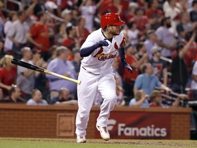 St. Louis Cardinals' Yadier Molina tosses his bat after hitting a walk-off single during the ninth inning of a baseball game against the Chicago White Sox Tuesday, May 1, 2018, in St. Louis. The Cardinals won 3-2.