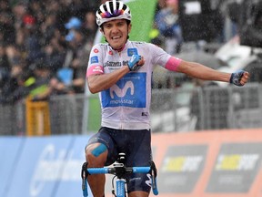 Ecuador's Richard Carapaz celebrates as he crosses the finish line to win the eight stage of the Giro d'Italia cycling race, from Praia a Mare to Montevergine di Mercogliano, Saturday, May 12, 2018. Richard Carapaz pulled off a superb final attack to win the eighth stage of the Giro d'Italia on Saturday, while British rider Simon Yates remained in the overall lead after the second mountain finish of the race.