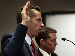 Michael Hafner, a former campaign worker for Missouri Gov. Eric Greitens, is sworn in before testifying before a Missouri House special investigative committee probing Greitens, Tuesday, May 29, 2018, in Jefferson City, Mo.
