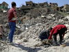 Volunteers recover human remains in Mosul’s Old City on April 9, 2018.