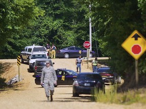 Authorities with Columbus Air Force Base work with local law enforcement and fire departments in responding to the scene of a U.S. Air Force T-38C Tallon II training jet crash, near the Lowndes-Monroe County line near Columbus, Miss., early Wednesday, May 23, 2018. The two pilots in the aircraft safely ejected before the crash and have been taken to a nearby hospital for evaluation. A plume of smoke from the crash could be seen in neighboring Columbus.