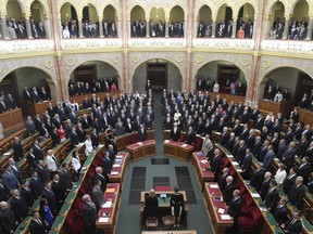 Lawmakers of the new Hungarian parliament sing the national anthem during the inaugural session of the new parliament in Budapest, Hungary, Tuesday, May 8, 2018. The governing Fidesz party in coalition with the Christian Democratic People's Party won a total 133 seats in Hungary's 199-strong national assembly in the general elections on April 8.