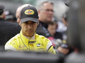 Helio Castroneves, of Brazil, waits during qualifications for the IndyCar Indianapolis 500 auto race at Indianapolis Motor Speedway in Indianapolis, Saturday, May 19, 2018.