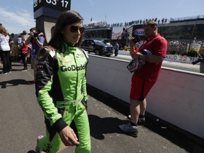 Danica Patrick makes her way to her car before the start of the Indianapolis 500 auto race at Indianapolis Motor Speedway, in Indianapolis Sunday, May 27, 2018.