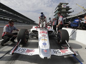 Marco Andretti climbs into his car during practice fort the IndyCar Indianapolis 500 auto race at Indianapolis Motor Speedway, in Indianapolis Tuesday, May 15, 2018.