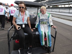 Pippa Mann, of England, rides out of the pit area after failing to make the field during qualifications for the IndyCar Indianapolis 500 auto race at Indianapolis Motor Speedway in Indianapolis, Saturday, May 19, 2018.