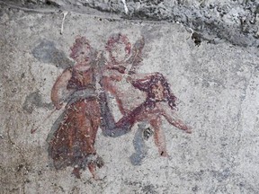 A detail of a fresco that was found during excavation works in the archaeological site of  Pompeii, Thursday, May 17, 2018. Archaeologists excavating an unexplored part of Pompeii have discovered a street of houses with intact balconies that were buried when Mt. Vesuvius erupted in 79 AD.