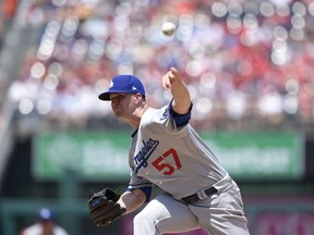 Los Angeles Dodgers starting pitcher Alex Wood delivers during the first inning of a baseball game against the Washington Nationals, Sunday, May 20, 2018, in Washington.