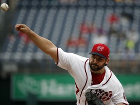 Washington Nationals starting pitcher Tanner Roark throws during the first inning of the first baseball game of a doubleheader against the Los Angeles Dodgers at Nationals Park, Saturday, May 19, 2018, in Washington.