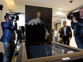 A painting attributed to famous Dutch Master Rembrandt is prepared for display at the Hermitage museum in Amsterdam, Netherlands, Wednesday, May 16, 2018. The unsigned painting which will be sold by gallery owner Jan Six, after being exhibit for a month at the Hermitage Amsterdam.