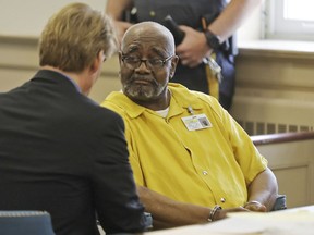 Attorney Matthew Reisig speaks with his client Hudy Muldrow before the start of the detention hearing, Wednesday, May 30, 2018, in Morristown, N.J.  Muldrow, a school bus driver facing two counts of vehicular homicide stemming from a crash this month on Interstate 80, was released pending trial Wednesday over the objections of prosecutors.