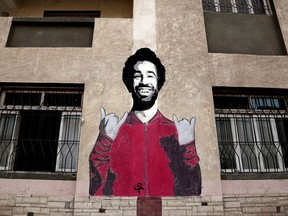 This May 2, 2018 photo, shows a wall mural of Mohamed Salah at a sports and youth center, in the Nile delta village of Nagrig, Egypt. Residents boast of how the Liverpool winger has poured millions of pounds into the village, with the beneficiaries' list including a school, a mosque, a youth center and a dialysis machine at a nearby hospital. His success as a footballer in Europe's most attractive league has inspired many parents in Nagrig to send their children to soccer academies in the hope that maybe one day they can emulate his success.