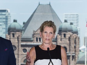 Ontario Liberal leader Kathleen Wynne speaks to the media while making a campaign stop in Toronto on Monday, May 28, 2018.