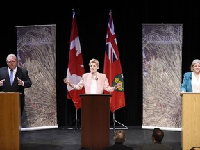 Ontario Progressive Conservative Leader Doug Ford, left to right, Ontario Liberal Leader Kathleen Wynne and Ontario NDP Leader Andrea Horwath take part in the second of three leaders' debate in Parry Sound, Ont., on Friday, May 11, 2018.