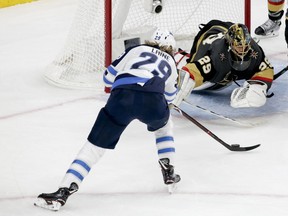 Vegas Golden Knights goaltender Marc-Andre Fleury blocks a shot by Winnipeg Jets right wing Patrik Laine during the second period of Game 4 of the NHL hockey Western Conference finals Friday, May 18, 2018, in Las Vegas.