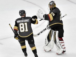 Vegas Golden Knights center Jonathan Marchessault, left, celebrates with goaltender Marc-Andre Fleury after the teams 4-2 win against the Winnipeg Jets during Game 3 of the NHL hockey playoffs Western Conference finals Wednesday, May 16, 2018, in Las Vegas.