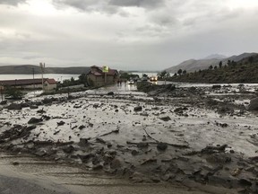 This image provided by Department of Public Safety/Nevada Highway Patrol Northern Command West shows mudslides on U.S. Highway 395 in Douglas County, Nev., north of the Nevada-California state line, Monday, May 21, 2018. The California Department of Transportation says Monday's mudslide is 100 feet (30.5 meters) in length and up to 4 feet (1.2 meters) deep. Nevada and California highway officials say there's no estimate for reopening the route in the area about 50 miles southeast of Lake Tahoe.  (Public Safety/Nevada Highway Patrol Northern Command West via AP)