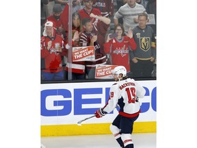 Fans watch Washington Capitals center Nicklas Backstrom, of Sweden, warm up for Game 2 of the team's NHL hockey Stanley Cup Finals against the Vegas Golden Knights on Wednesday, May 30, 2018, in Las Vegas.