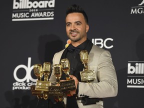 Luis Fonsi, winner of the awards for hot Latin song of the year, hot Latin song of the year - vocal event, airplay song of the year, digital song of the year, streaming song of the year and Latin pop song of the year for "Despacito" and hot Latin songs artist of the year - male, poses in the press room at the Billboard Music Awards at the MGM Grand Garden Arena on Sunday, May 20, 2018, in Las Vegas.