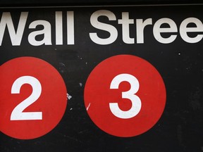 FILE - This Friday, Jan. 15, 2016, file photo shows a sign for a Wall Street subway station in New York.  Stocks are opening broadly higher on Wall Street, Wednesday, May 9, 2018, led by gains in energy companies as the price of crude oil moved back above $70 a barrel.