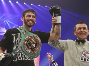 FILE - In this Dec. 30, 2014 file photo, Jorge Linares of Venezuela celebrates after defeating Javier Prieto of Mexico during their 12-round scheduled vacant WBC Light weight title bout in Tokyo.  Linares will fight Vasyl Lomachenko, of Ukraine, Saturday, May 12, 2018,  for Linares' WBA lightweight championship in New York.