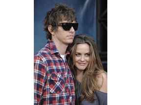 FILE - In this Thursday July 31, 2008 file photo, Christopher Jarecki and Alicia Silverstone arrive at the premiere of "Pineapple Express" in Mann Village Theater in Los Angeles. Alicia Silverstone is divorcing her husband of nearly 13 years. The "Clueless" actress filed for divorce from Christopher Jarecki on Friday, May 25, 2018 in Los Angeles County Superior Court.