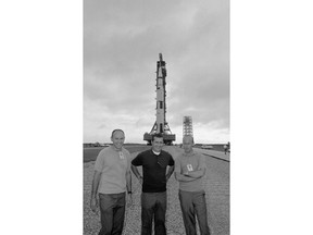 FILE - In this Sept. 8, 1969 file photo, Apollo 12 moon mission crewmen pose in front of their Saturn 5 space vehicle as the rocket was rolled out of the VAB at Cape Kennedy Sept. 8, 1969 toward launch pad at complex 39. From left are Lunar Module Pilot Alan Bean; Command Module Pilot Richard Gordon and Commander Charles Conrad.  Bean, the Apollo and Skylab astronaut, fourth human to walk on the moon and an accomplished artist, has died. Bean, 86, died on Saturday, May 26, 2018 at Houston Methodist Hospital in Houston.