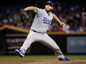 FILE - In this May 1, 2018, file photo, Los Angeles Dodgers starting pitcher Clayton Kershaw throws against the Arizona Diamondbacks during the first inning of a baseball game in Phoenix. Dodgers ace Clayton Kershaw was put on the 10-day disabled list with left biceps tendinitis. A three-time NL Cy Young Award winner, Kershaw is on the disabled list for the fourth time.