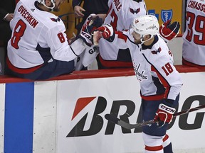 FILE - In this May 1, 2018, file photo, Washington Capitals rookie Chandler Stephenson (18) returns to the bench where he is congratulated by Alex Ovechkin after scoring against the Pittsburgh Penguins during the second period in Game 3 of an NHL second-round hockey playoff series in Pittsburgh. The Capitals have never used more rookies during a single postseason than the half-dozen who helped Alex Ovechkin and Co. reach the Eastern Conference final against the Tampa Bay Lightning.