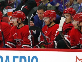 FILE - In this Nov. 22, 2017, file photo, Rod Brind'Amour talks with Marcus Kruger (16) during the first period of an NHL hockey game against the New York Rangers, in Raleigh, N.C. A person familiar with the situation tells The Associated Press that former Carolina captain Rod Brind'Amour is expected to be promoted to head coach of the Hurricanes.  The person said the deal was being finalized and the announcement could come later this week. The person spoke on condition of anonymity Tuesday, May 8, 2018,  because the team has not publicly discussed its coaching search.