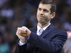 FILE- In this Wednesday, May 9, 2018 photo, Boston Celtics head coach Brad Stevens gestures during the first quarter of Game 5 of an NBA basketball playoff series in Boston. In just his fifth season Stevens has endeared himself to a championship-driven city after helping Boston make in improbable run back to the conference finals.