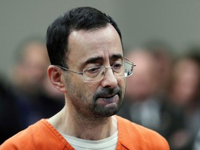 In this Nov. 22, 2017 file photo, Dr. Larry Nassar, 54, appears in court for a plea hearing in Lansing, Mich.
