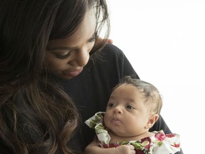 In a photo provided by HBO date not provided, Serena Williams holds her daughter, Alexis Olympia Ohanion Jr., in a scene from the HBO's "Being Serena," a five-part documentary series. The series airs Wednesday nights, starting this week. (HBO via AP)