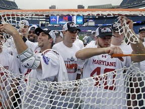 FILE - In this May 29, 2017, file photo, Maryland players cut the net to celebrate after their victory over Ohio State in the NCAA college Division 1 lacrosse championship final in Foxborough, Mass. Defending champion Maryland is the top seed for the men's NCAA lacrosse tournament. The first round starts Saturday, May 12, 2018.