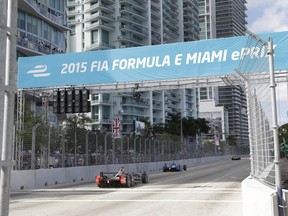 FILE - In  this March 14, 2015, file photo, cars race on downtown Miami streets during the Formula E Miami ePrix auto race, in Miami. Formula One has announced plans for a street race in Miami starting in 2019. Miami city officials are scheduled to vote next week on a plan to stage a race the series has long coveted as it seeks to enlarge its presence in the United States. A Miami race would be the second in the U.S., joining the U.S. Grand Prix in Austin, Texas.