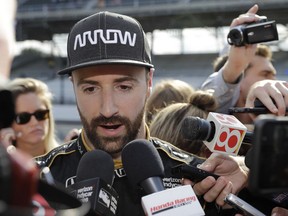 FILE- In this May 19, 2018 file photo, James Hinchcliffe, of Canada, talks with the media after he did not qualify for the IndyCar Indianapolis 500 auto race at Indianapolis Motor Speedway in Indianapolis. James Hinchcliffe once likened Indianapolis Motor Speedway to a cruel mistress. He found out just how cruel when he was bumped from the race that means the most to him and to any IndyCar driver. But he will be at the track Sunday trying to help his teammates win the Indy 500.