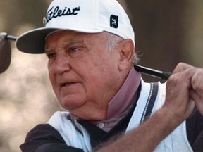 FILE - In this April 10, 1997, file photo, Doug Ford watches his shot during his opening round if the Masters Tournament at the Augusta National Golf Club in Augusta, Ga. Ford, the oldest surviving Masters champion and a Hall of Famer, died Monday, May 14, 2018. He was 95.