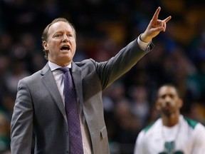 FILE - In this April 8, 2018, file photo, Atlanta Hawks coach Mike Budenholzer signals during the third quarter of the team's NBA basketball game against the Boston Celtics in Boston. A person familiar with the search tells The Associated Press that the Milwaukee Bucks have reached agreement with Budenholzer to become the team's next coach. The 2015 NBA Coach of the Year will replace Joe Prunty, the former assistant who went 21-16 in the regular season after replacing the fired Jason Kidd in late January.