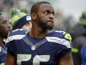 FILE - In this Dec. 24, 2016, file photo, Seattle Seahawks' Cliff Avril stands on the field before an NFL football game against the Arizona Cardinals in Seattle. Avril as released by the Seahawks on Friday, May 4, 2018, with a failed physical designation due to a neck injury that cost him most of the 2017 season.