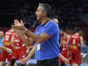 FILE - In this Sept. 17, 2017, file photo, Slovenia coach Igor Kokoskov applauds during the Eurobasket European Basketball Championship final against Serbia in Istanbul. The Phoenix Suns have hired Kokoskov, a Utah Jazz assistant, as their new head coach. The 46-year-old Serbian becomes the first NBA head coach born outside the United States. He served as a Suns assistant from 2008 to 2013, a stretch that included Phoenix's 2010 run to the Western Conference finals.