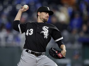 FILE - In this March 31, 2018, file photo, Chicago White Sox relief pitcher Danny Farquhar throws during the team's baseball game against the Kansas City Royals at Kauffman Stadium in Kansas City, Mo. Minnesota Twins' Logan Morrison and Jake Odorizzi were encouraged after visiting former teammate Farquhar in the hospital Friday, May 4. Morrison was "really blown away" at how well Farquhar was doing after collapsing in the dugout with a ruptured aneurysm on April 20. Odorizzi says when he walked into the room at Rush University Medical Center, Farquhar stood from a couch and hugged him.