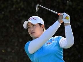 FILE - In this April 20, 2018, file photo, Moriya Jutanugarn, of Thailand, watches her shot from the seventh tee during the second round of the LPGA Tour's HUGEL-JTBC LA Open golf tournament at Wilshire Country Club in Los Angeles. Ariya and Moriya Jutanugarn play golf and live life differently. The sisters from Thailand have won two of the last four LPGA tournaments and are attempting at the Volvik Championship to become the first two-time winner this year.