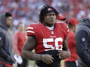 FILE - In this Oct. 22, 2017, file photo, San Francisco 49ers linebacker Reuben Foster (56) stands on the sideline during an NFL football game against the Dallas Cowboys in Santa Clara, Calif. A Santa Clara County judge has ruled that San Francisco 49ers linebacker Reuben Foster will not have to stand trial on domestic violence charges after the accuser recanted her allegations at a preliminary hearing, Wednesday, May 23, 2018.