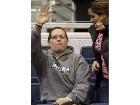 FILE - In this Feb. 16, 2012, file photo, Claire Droesch, left, waves to the crowd during Hofstra's NCAA college basketball loss to Delaware in Hempstead, N.Y. Former Boston College women's basketball star Droesch died on Friday, May 11, 2018, after a six-year battle with breast cancer the school announced.