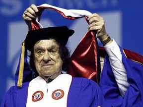 FILE - In this May 29, 2010, file photo, author Richard Goodwin receives a Doctor of Humane Letters honorary degree from Trustee Edward Collins during commencement ceremonies at UMass-Lowell at the Tsongas Center in Lowell, Mass. Former White House aide and speechwriter Goodwin has died. He died Sunday, May 20, 2018, at his home in Concord, Mass. His wife, the historian Doris Kearns Goodwin, said he died after a brief bout with cancer.