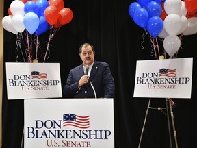 FILE - In this May 8, 2018, file photo, former Massey Energy CEO Don Blankenship speaks to supporters in Charleston, W.Va. Despite having lost the Republican primary, convicted ex-coal baron Blankenship said he's going to continue his bid for U.S. Senate as a third-party candidate. Blankenship's campaign said in a news release Monday, May 21, that he'll be running as a member of the Constitution Party, which nominated him by a unanimous vote.