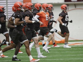 FILE - In this May 4, 2018, file photo, Cleveland Browns quarterback Baker Mayfield (6) runs a drill during rookie minicamp at the NFL football team's training camp facility in Berea, Ohio. A person familiar with the decision says the Browns will appear on HBO's "Hard Knocks" this season. Coming off a historic 0-16 season, the Browns were chosen after declining the opportunity several times, said the person who spoke Thursday, May 17, to The Associated Press on condition of anonymity.