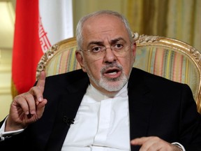 FILE - In this April 24, 2018, file photo, Iran's Foreign Minister Mohammad Javad Zarif is interviewed by The Associated Press, in New York. Zarif has taken to YouTube on Thursday, May 3, to criticize President Donald Trump's threat to withdraw from the nuclear deal, saying Iran will not "renegotiate or add onto" the atomic accord.