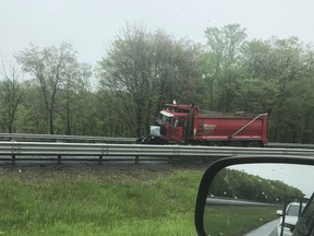 A dump truck sits near the scene after a collision with a school bus in Mount Olive, N.J., Thursday, May 17, 2018.