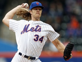 New York Mets starting pitcher Noah Syndergaard delivers during the first inning of a baseball game against the Colorado Rockies on Sunday, May 6, 2018, in New York.